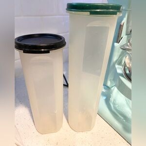 Tupperware containers set of two tall One with black lid and one with green lid.